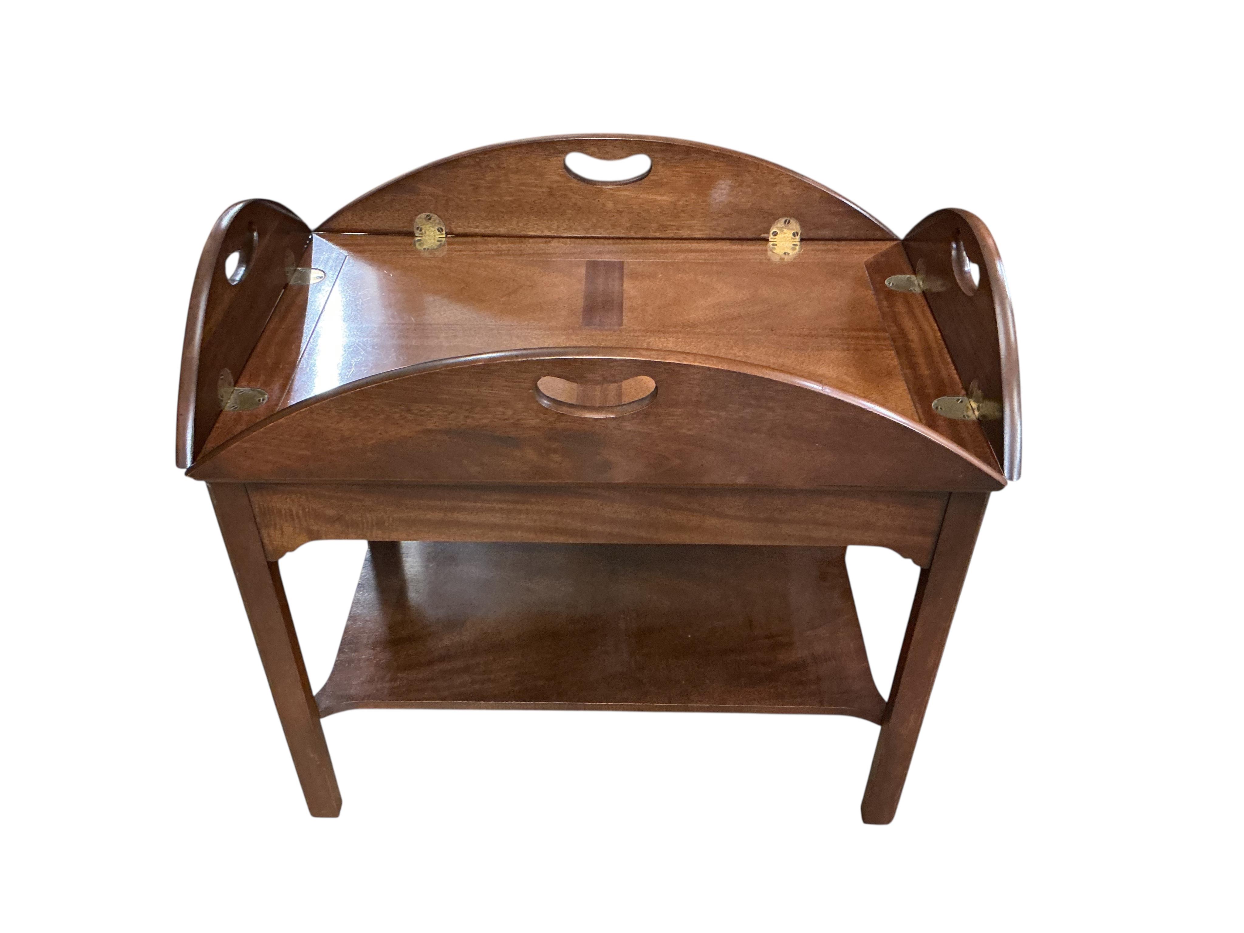 A reproduction George III style mahogany butler's tray, on stand, width 74cm, depth 48cm, height 68cm